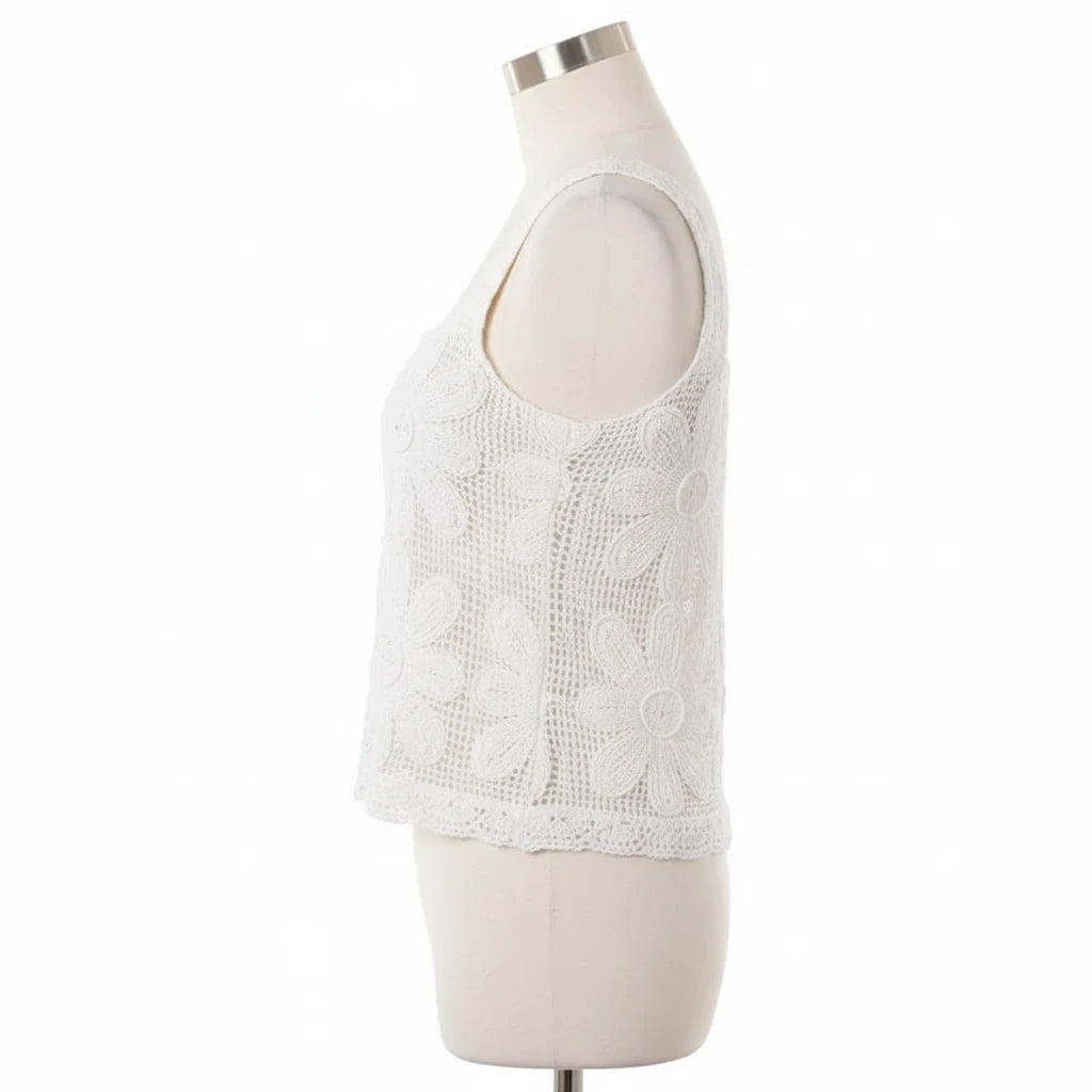 The Chic Nest white sleeveless crochet top with intricate floral patterns and a square neckline on a mannequin